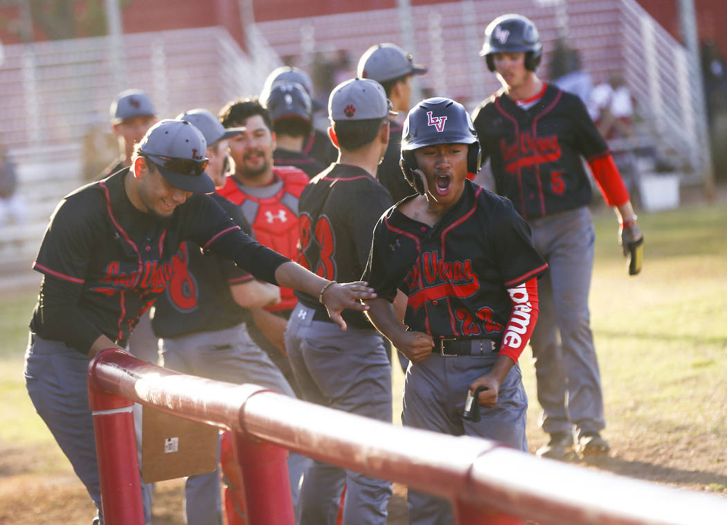 Las Vegas' Layne Adaro (22) celebrates his run against Arbor View during a baseball game at Arb ...