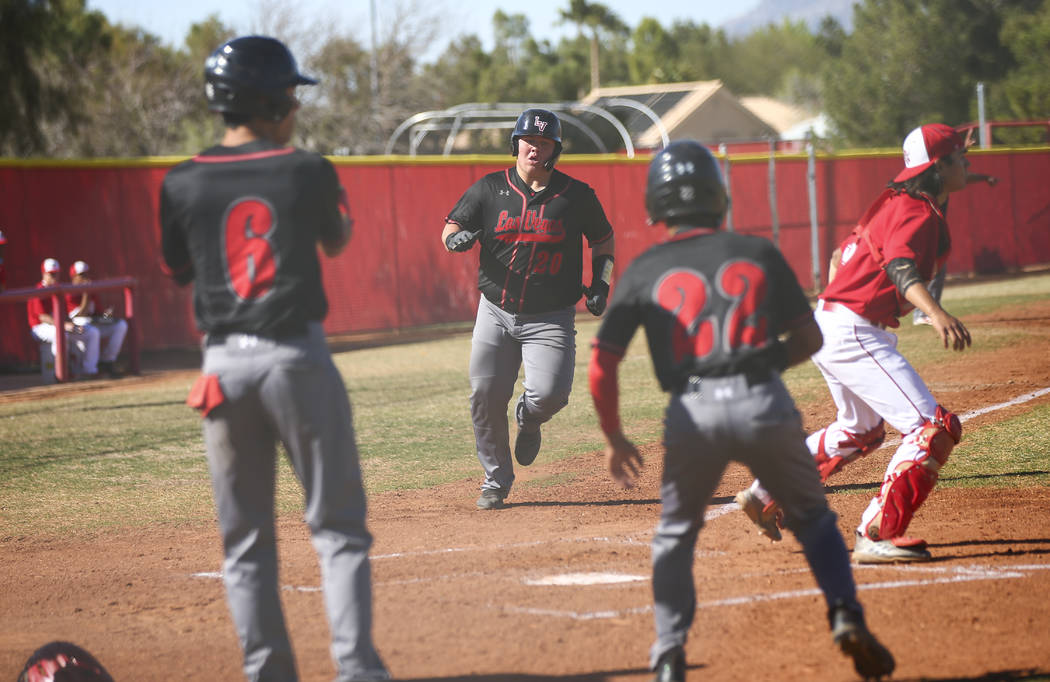 Las Vegas' first baseman Trevor Johnson (20) scores a run during a baseball game at Arbor View ...