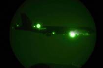 A B-52H Stratofortress assigned to the 20th Expeditionary Bomb Squadron is seen through night v ...