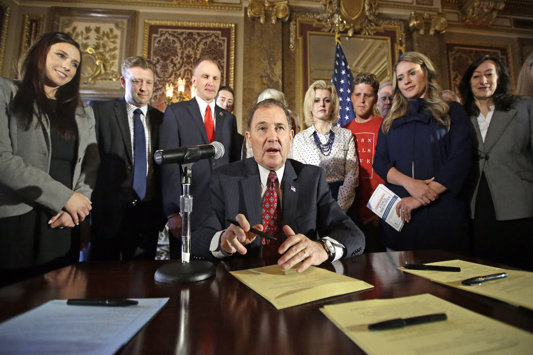 In this April 19, 2016, file photo, Utah Gov. Gary Herbert looks up during a ceremonial signing ...