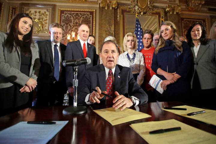 In this April 19, 2016, file photo, Utah Gov. Gary Herbert looks up during a ceremonial signing ...