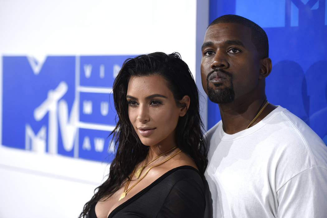 In this Aug. 28, 2016 file photo, Kim Kardashian West, left, and Kanye West arrive at the MTV V ...