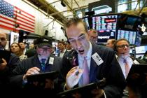 Stock trader Gregory Rowe works at the New York Stock Exchange, Friday, May 10, 2019. (AP Photo ...