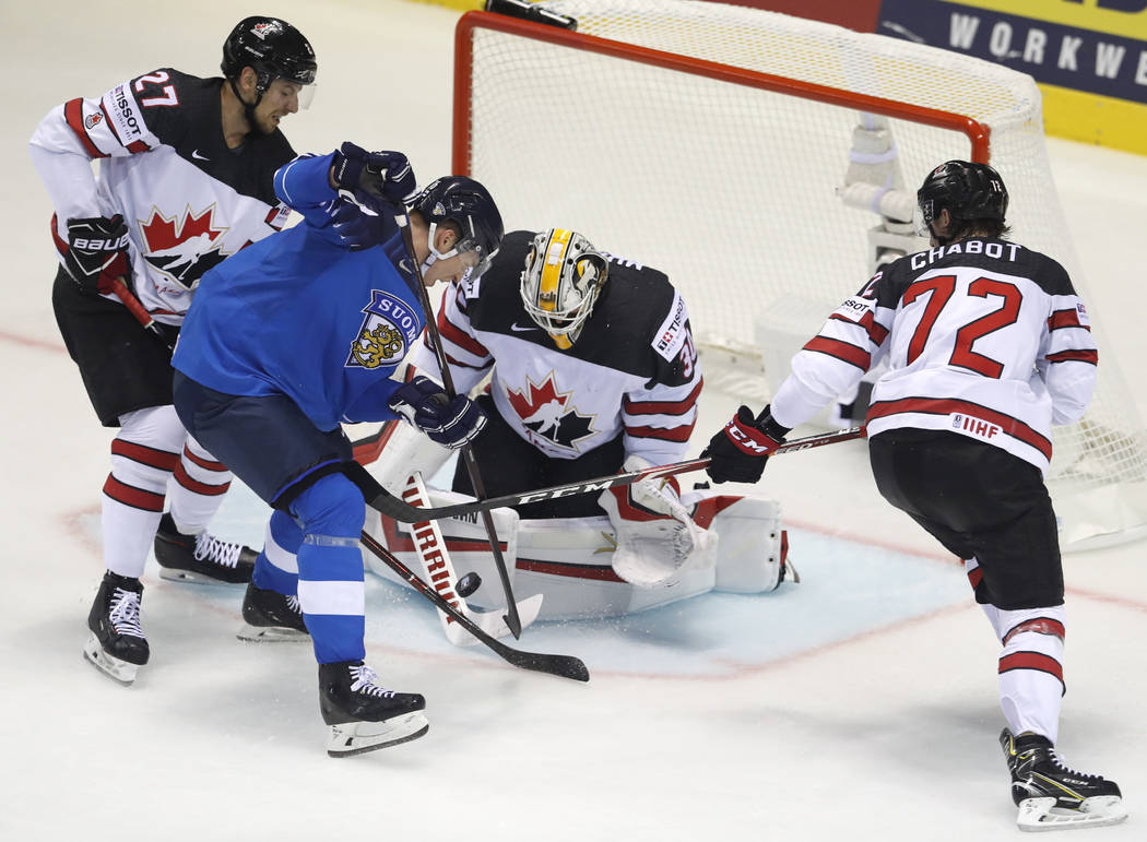 Canada's goaltender Matt Murray, 2nd right, and is teammates Thomas Chabot, right, and Shea The ...