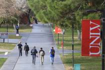 Students walk along a sidewalk at UNLV in 2017 in Las Vegas. (Las Vegas Review-Journal)