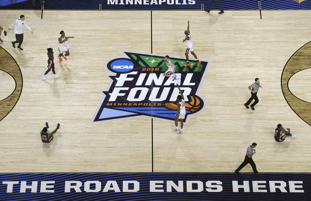 Virginia players celebrate after defeating Auburn 63-62 in the semifinals of the Final Four NCA ...