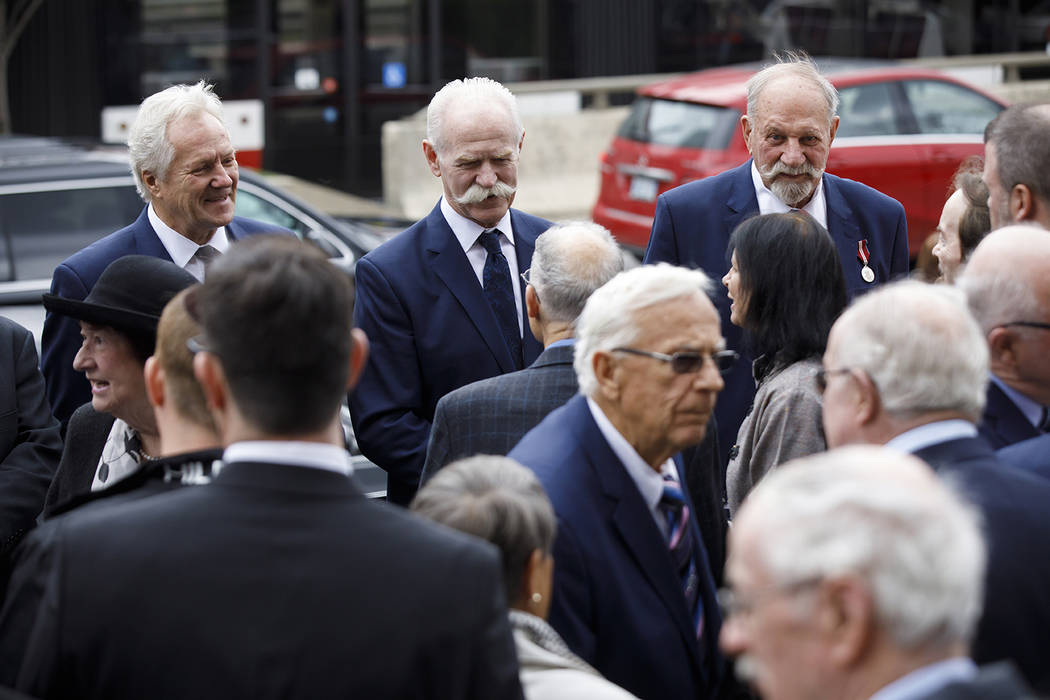 Toronto Maple Leafs' alumni, from left, Darryl Sittler, Lanny McDonald, and Eddie Shack greet m ...