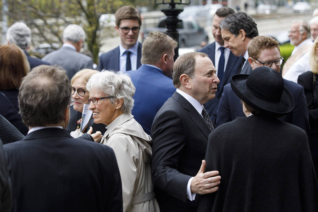 NHL commissioner Gary Bettman, center right, greets mourners following the funeral Mass for NHL ...