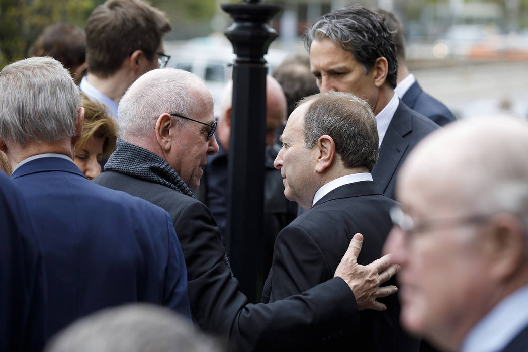 Maple Leafs Sports and Entertainment chairman Larry Tanenbaum, left, greets NHL commissioner Ga ...