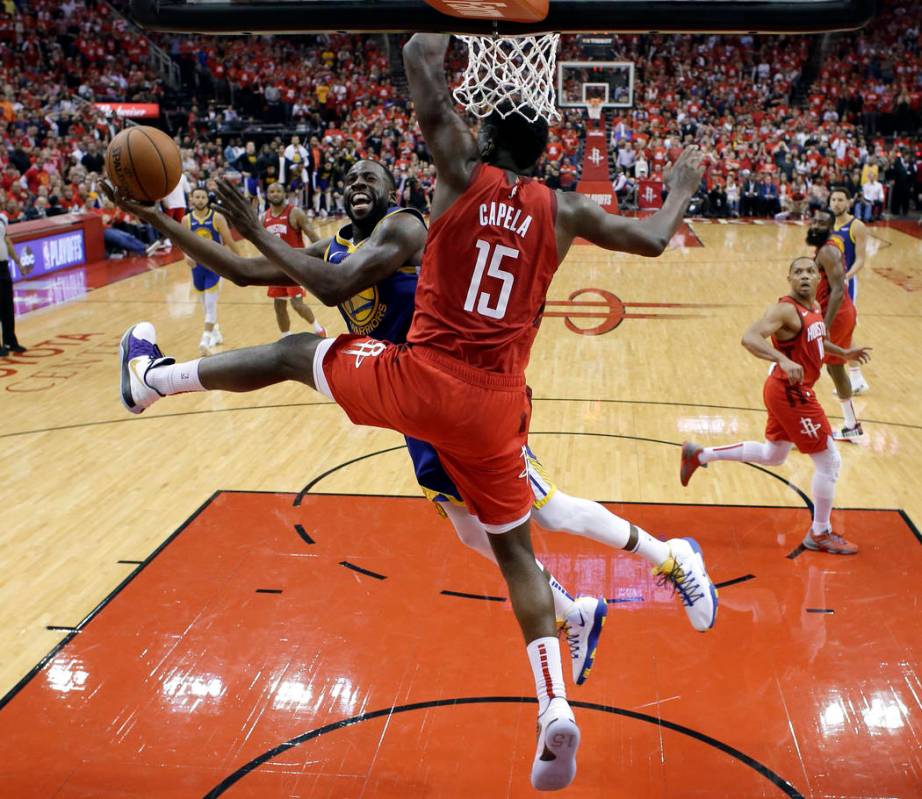 Golden State Warriors' Draymond Green (23) goes up for a shot as Houston Rockets' Clint Capela ...