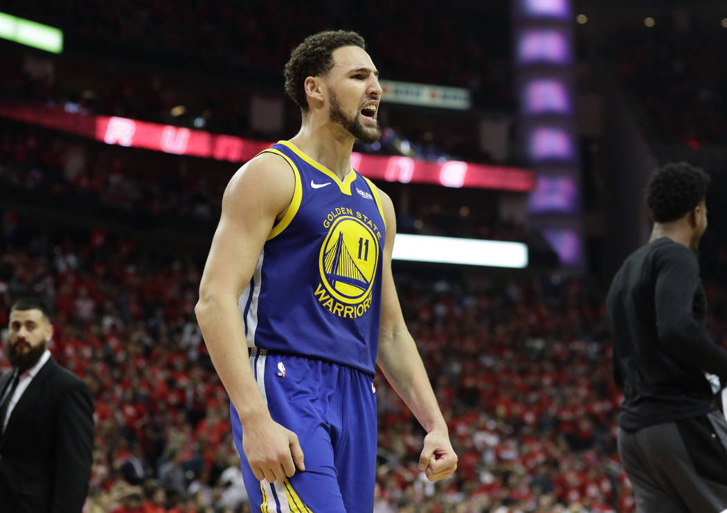 Golden State Warriors guard Klay Thompson celebrates the team's win over the Houston Rockets in ...