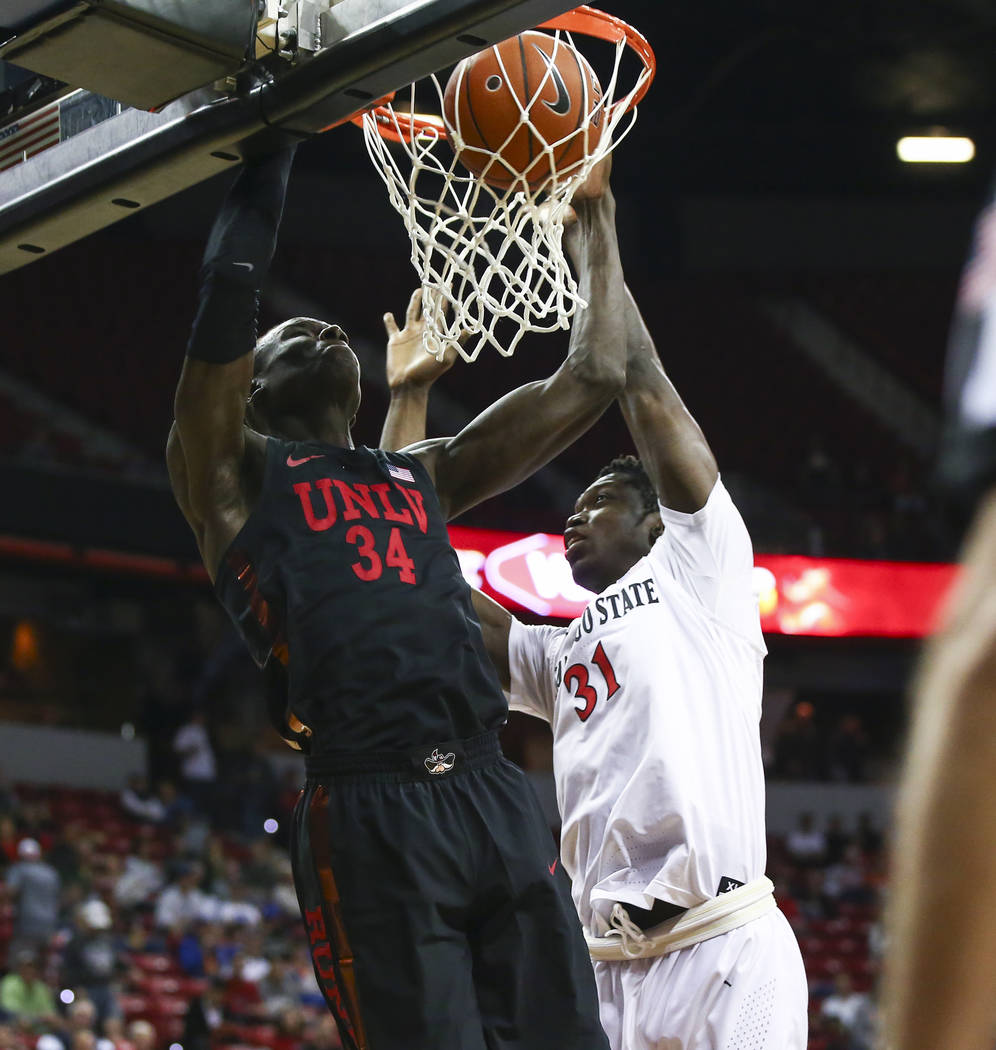 UNLV Rebels forward Cheikh Mbacke Diong (34) dunks against San Diego State Aztecs forward Natha ...