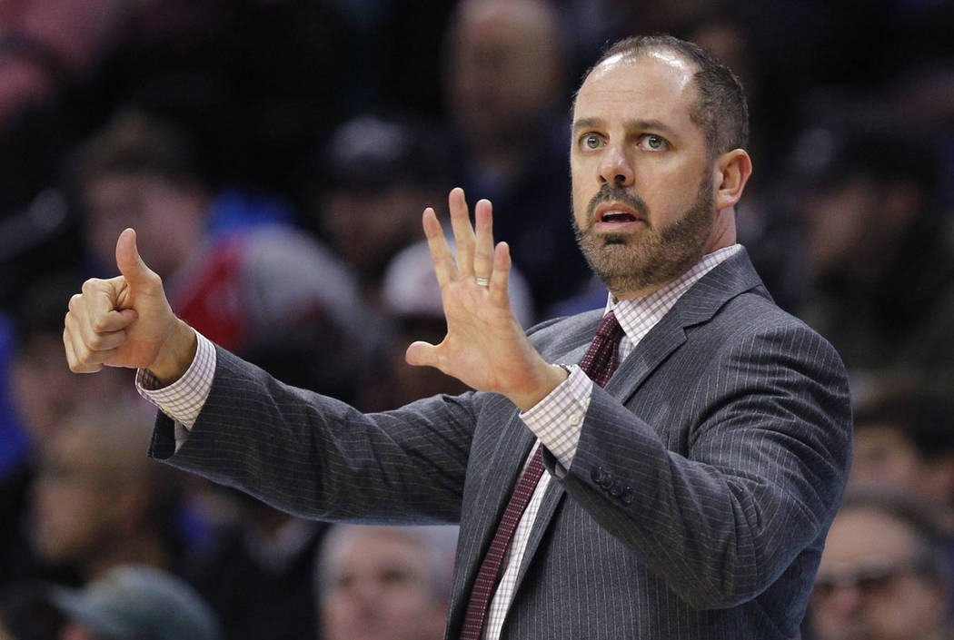 Orlando Magic coach Frank Vogel signals from the sideline during the team's game against the Ph ...