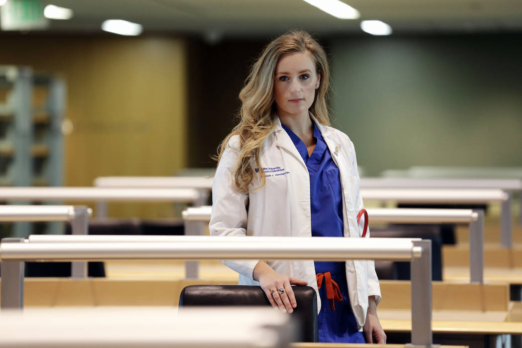 In this May 2, 2019, photo, Savanah Harshbarger, a medical student at Duke University, poses fo ...