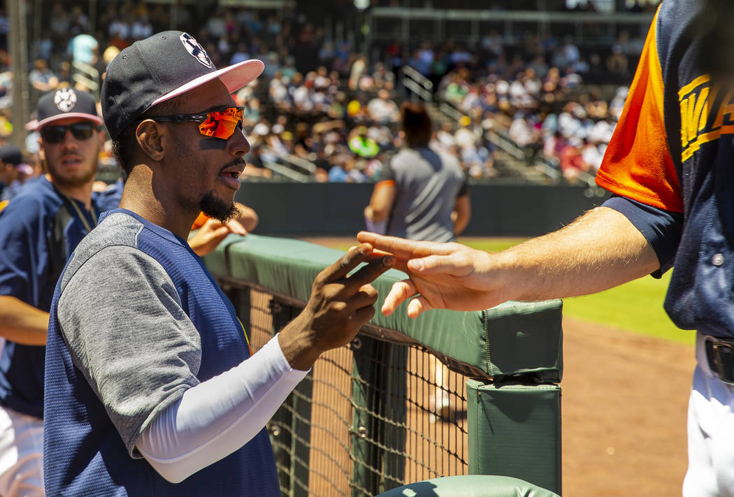 Aviators shortstop Jorge Mateo (14) encourages his teammates from the dugout as they face the T ...