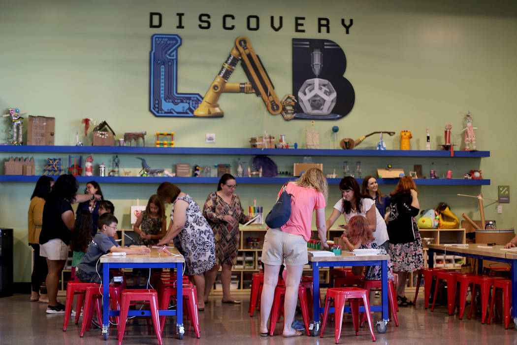 Attendees at the Mother's Day Morning of Cookies & Canvas event at Discovery Children's Mus ...