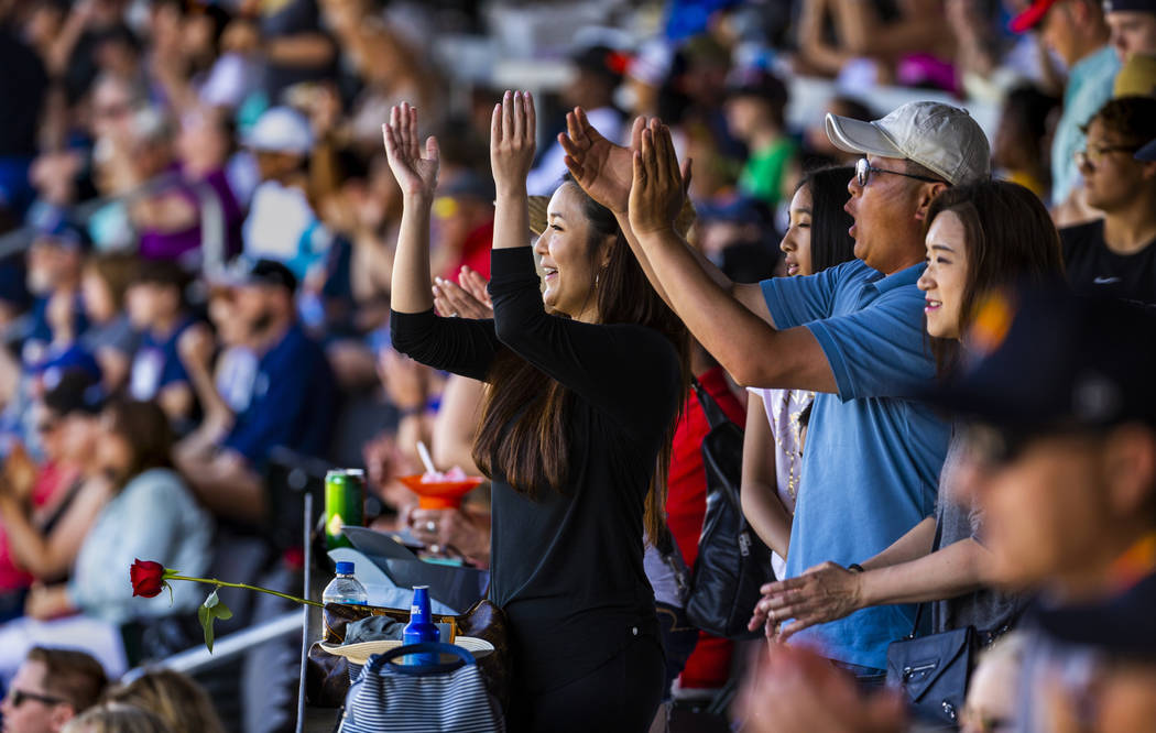 Aviators fans Stacy Chen, Kylie Huang, 11, with Kevin and Gloria Lin celebrate another run late ...