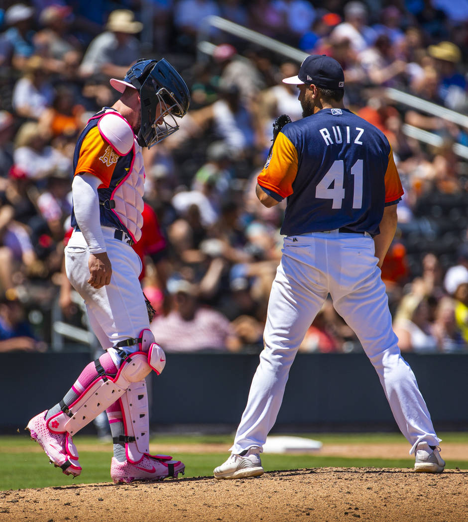 The Aviators Beau Taylor (6) comes out to the mound to consult with pitcher Norge Ruiz (41) dur ...