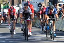 Peter Sagan, of the Bora-hansgrohe team, second from left, crosses the finish line ahead Travis ...