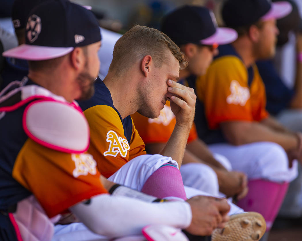 The Aviators Corban Joseph (5) is feeling the strain of a possible loss while in the dugout dur ...