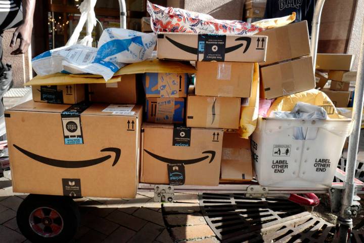 In this Oct. 10, 2018, file photo Amazon Prime boxes are loaded on a cart for delivery in New Y ...