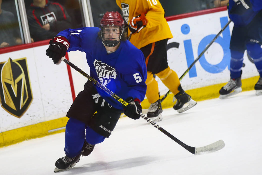 Team Blue's Matthew Gross (51) chases after the puck against Team Yellow during a game in the U ...