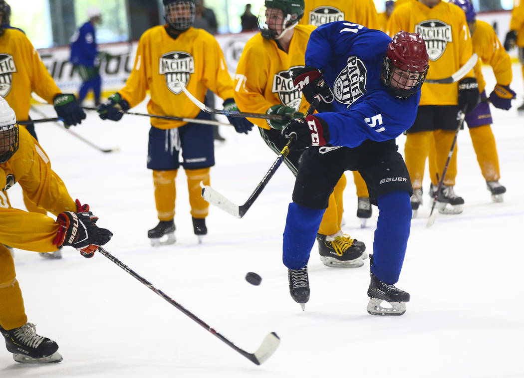 Team Blue's Matthew Gross (51) shoots against Team Yellow during a game in the USA Hockey Pacif ...