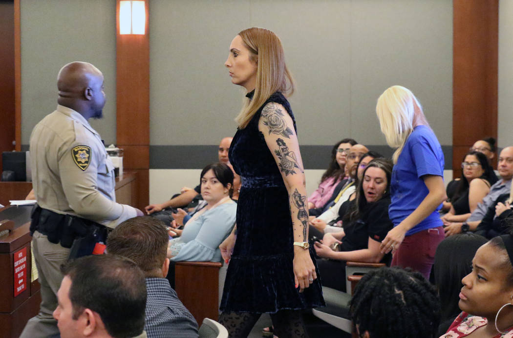 Suspended attorney Alexis Plunkett enters the courtroom for her sentencing at the Regional Just ...