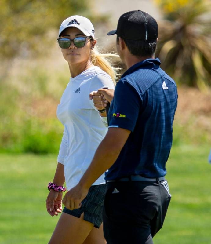 LPGA golfer and caddy Danielle Kang congratulates her brother Alexander Kang on another great s ...