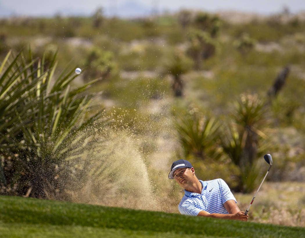 Golfer Shane Crampton blasts a ball out of a sand trap during a PGA US Open qualifying round at ...