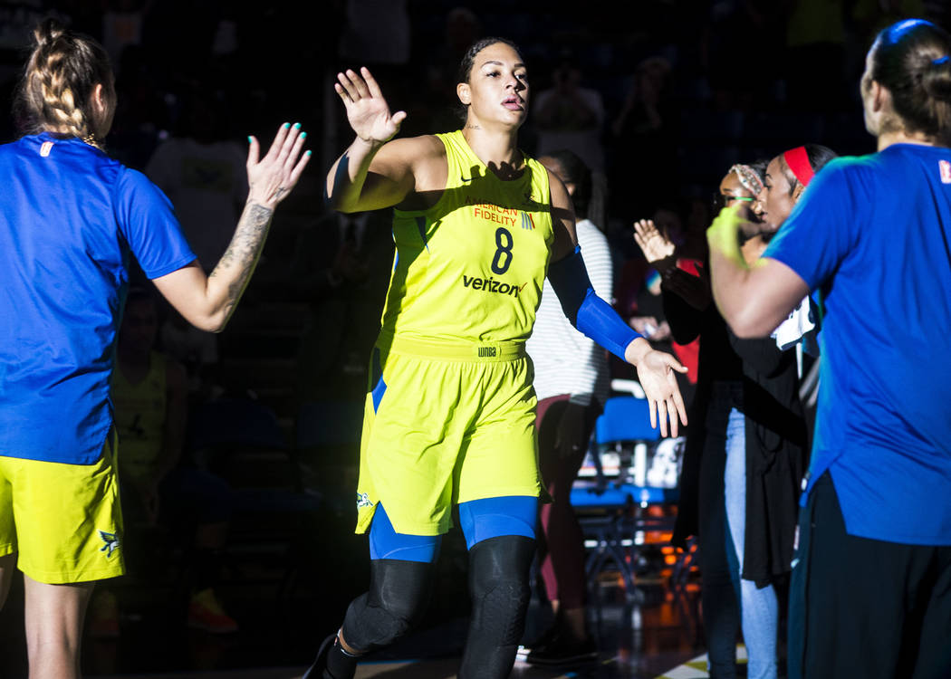 Dallas Wings center Liz Cambage (8) is welcomed on the court before the game against the Las Ve ...