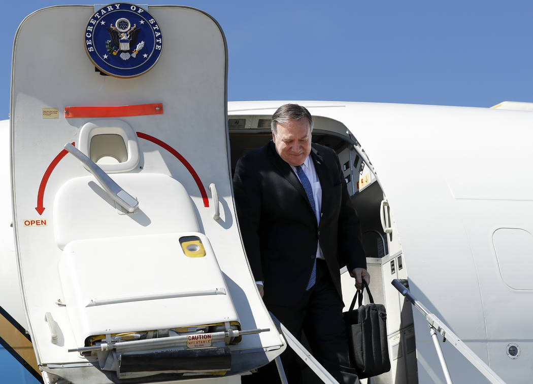 U.S. Secretary of State Mike Pompeo steps down from the plane upon his arrival at the airport i ...