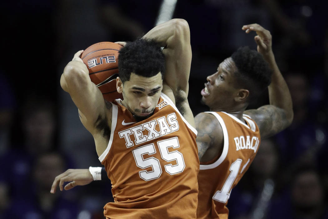 Texas guard Elijah Mitrou-Long (55) and Texas guard Kerwin Roach II (12) during the first half ...