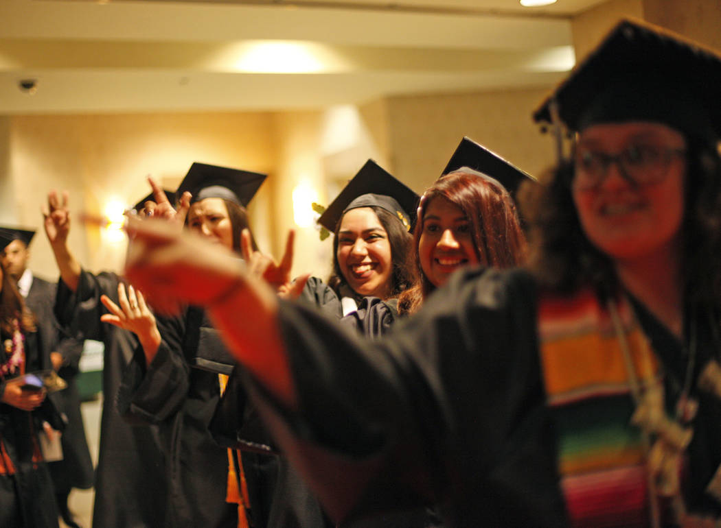 Students of the first graduating class for the new Deaf Studies program show signs of "I love y ...