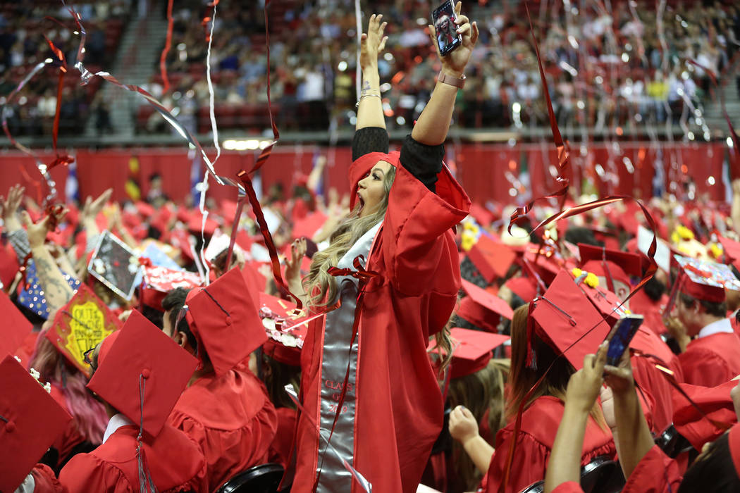 Psychology major Sharon Kotler, 23, center, of Las Vegas, celebrates at the end of the program ...