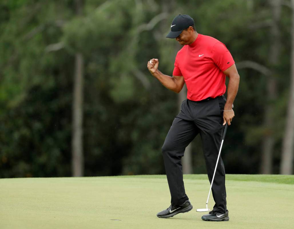 Tiger Woods reacts as he wins the Masters golf tournament Sunday, April 14, 2019, in Augusta, G ...