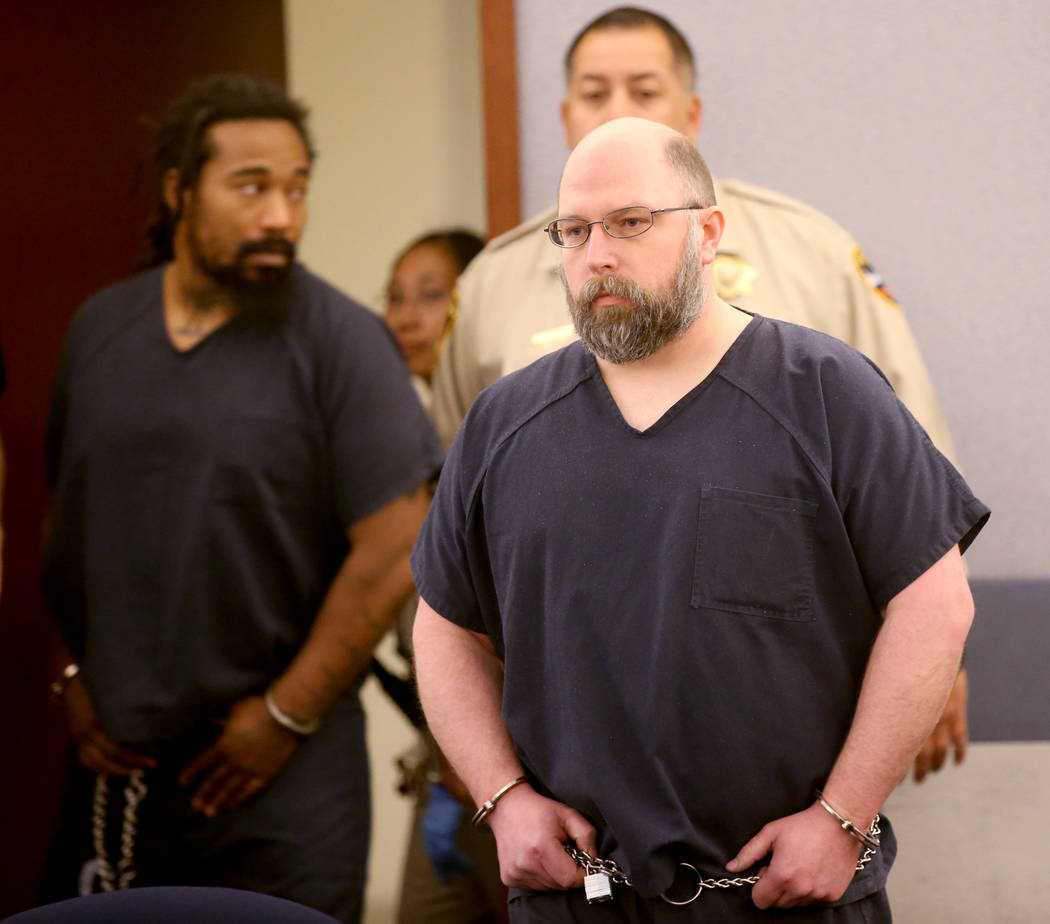 Former Las Vegas police officer Bret Theil is led into the courtroom at the Regional Justice Ce ...