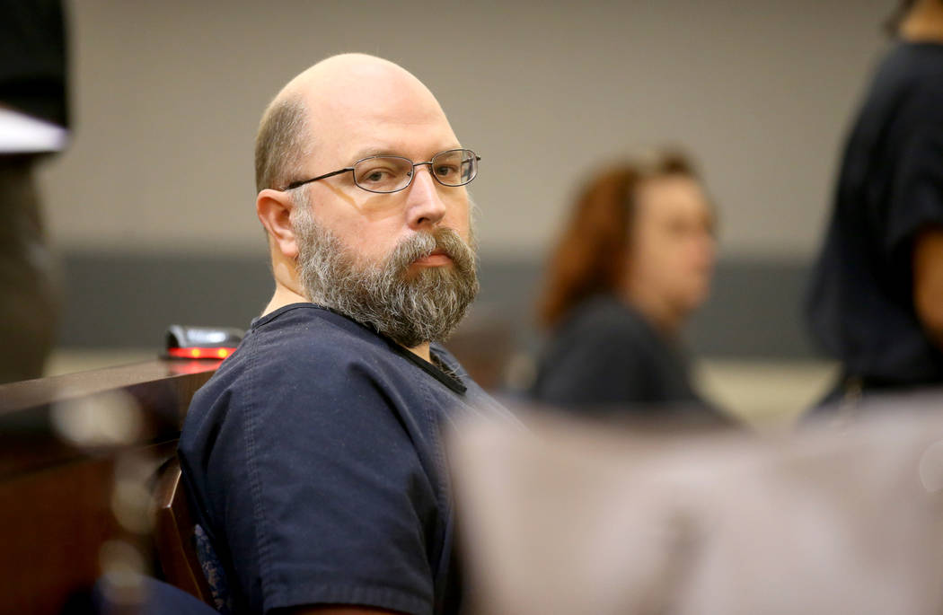 Former Las Vegas police officer Bret Theil waits in the courtroom at the Regional Justice Cente ...