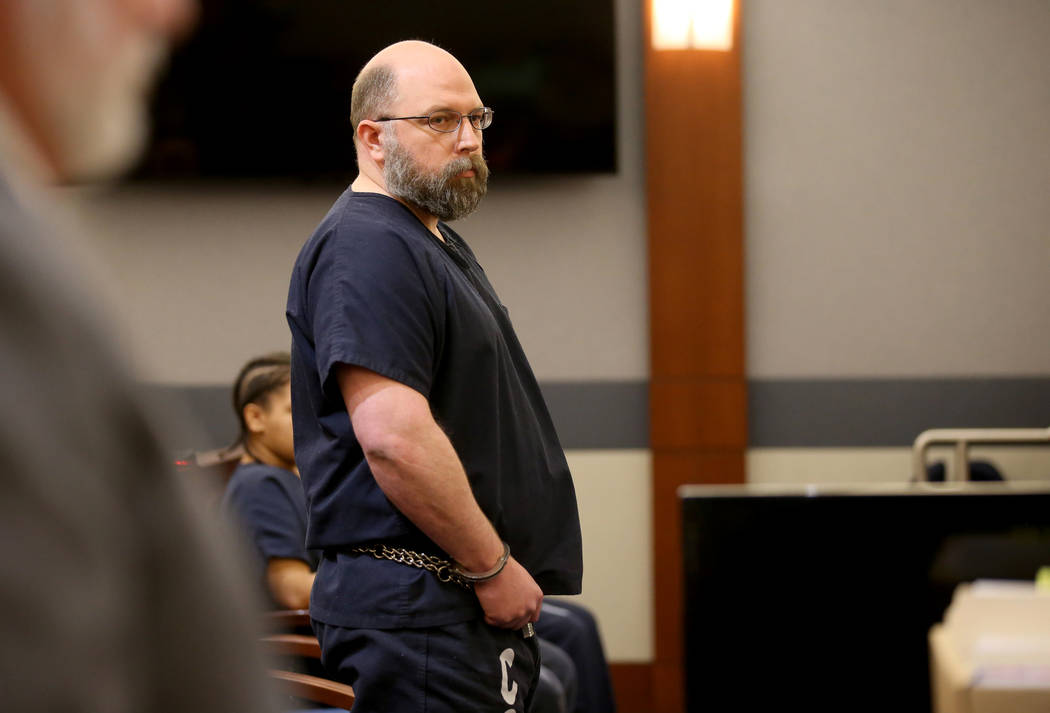 Former Las Vegas police officer Bret Theil listens to his victim read a statement at the Region ...