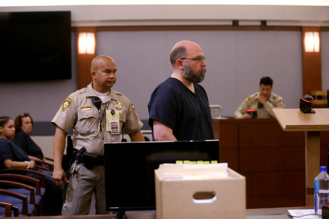 Former Las Vegas police officer Bret Theil is led out of the courtroom at the Regional Justice ...