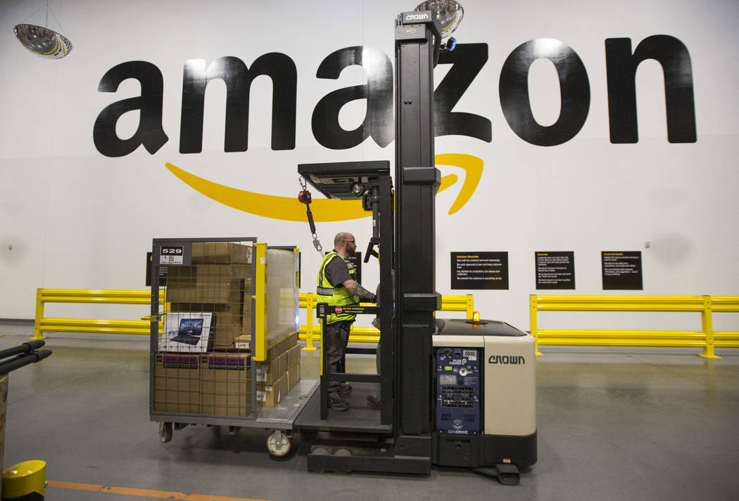 A forklift driver navigates through Amazon's North Las Vegas fulfillment center. (Review-Journa ...