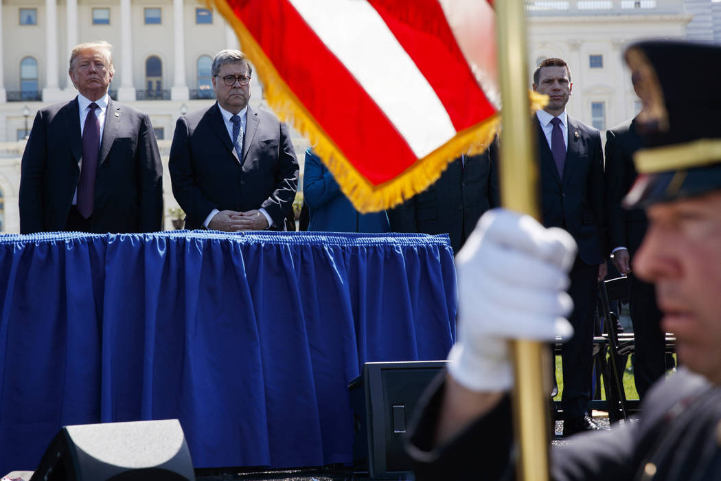 President Donald Trump stands with Attorney General William Barr during the 38th Annual Nationa ...