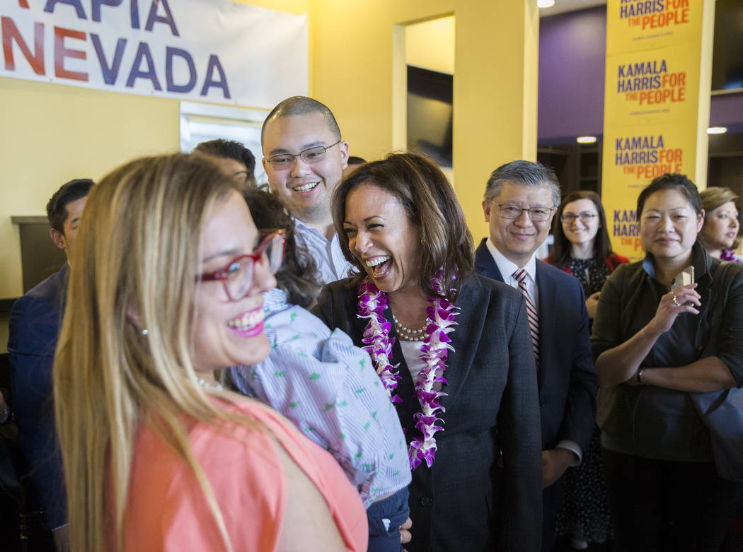 Presidential candidate Sen. Kamala Harris, middle, D-Calif., mingles with guests during a meet ...