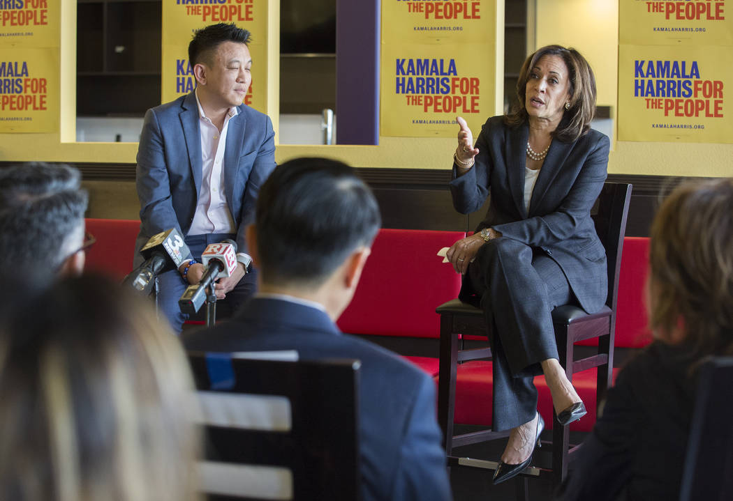 Presidential candidate Sen. Kamala Harris, right, D-Calif., addresses the audience during a mee ...