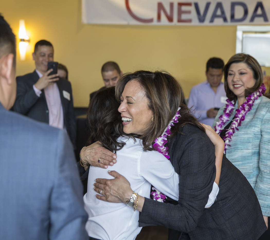 Presidential candidate Sen. Kamala Harris, right, D-Calif., gets a hug from Cevan Louie during ...