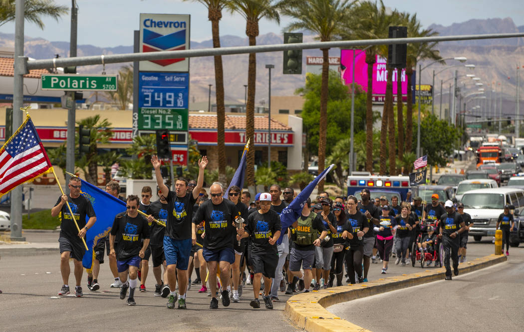 Nevada law enforcement officers and Special Olympics Nevada athletes make their way up Russell ...