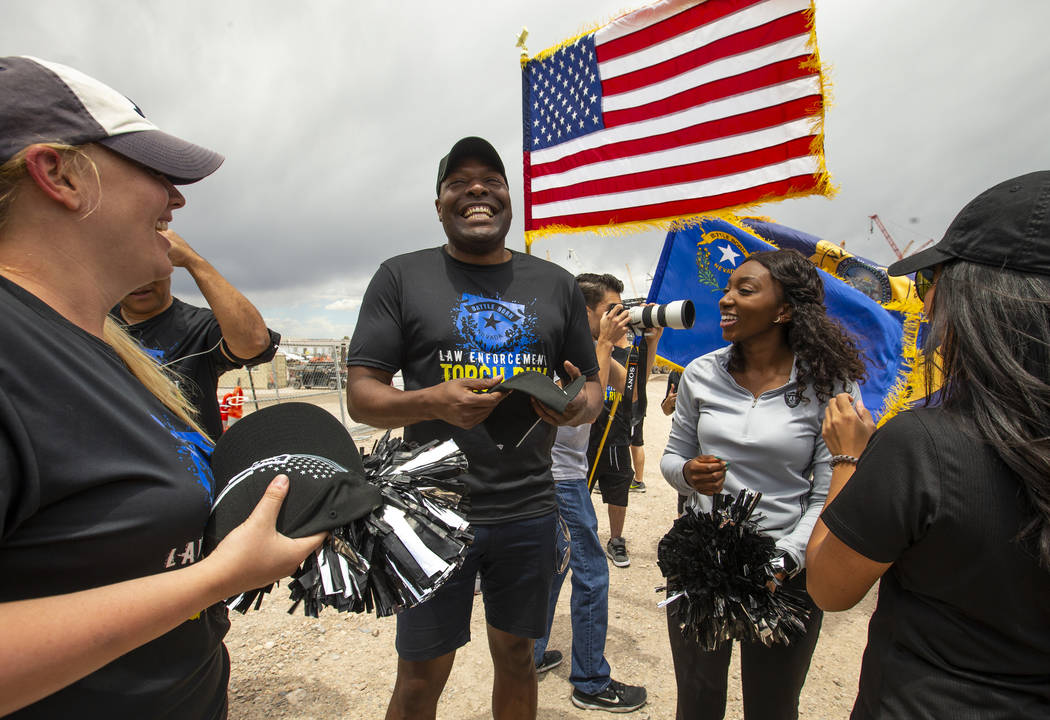 Terrence Thornton receives a new Raiders hat at the Las Vegas Stadium site during the Southern ...