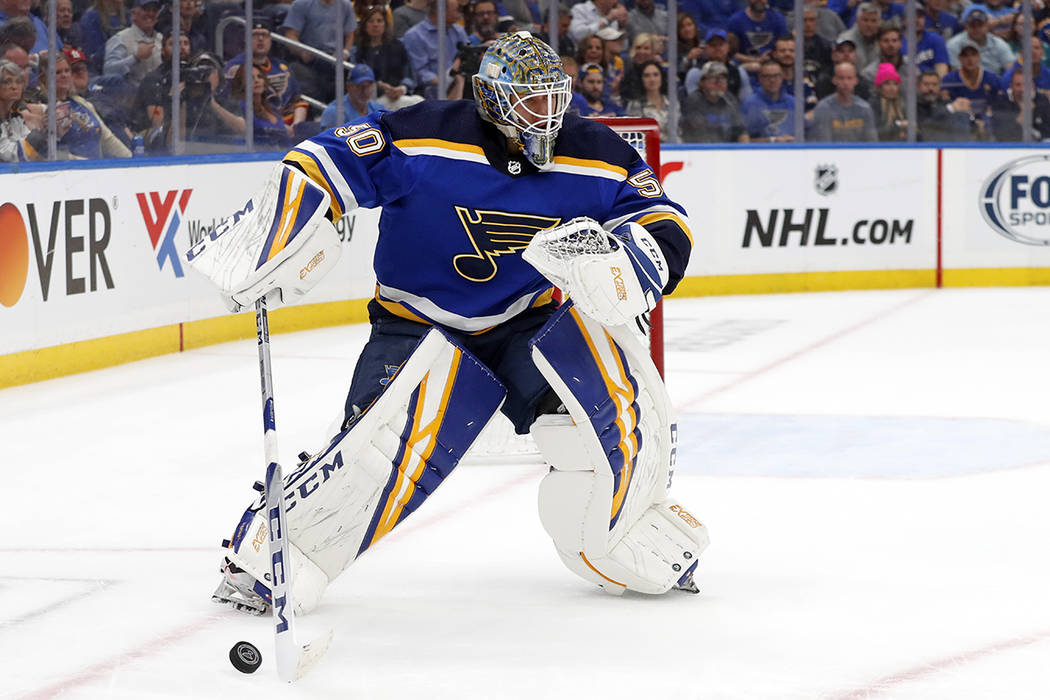 St. Louis Blues goaltender Jordan Binnington handles the puck against the San Jose Sharks durin ...