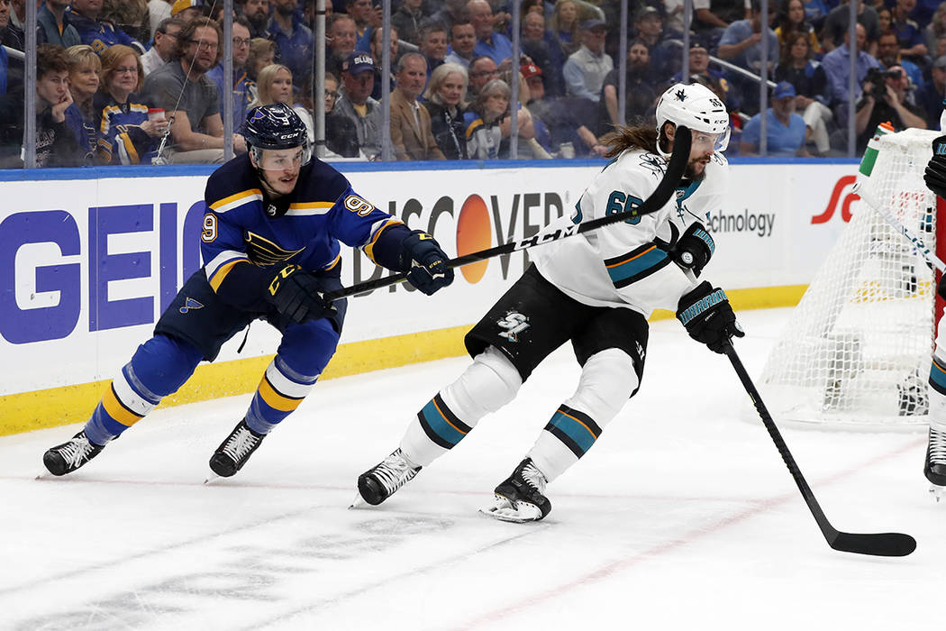 St. Louis Blues left wing Sammy Blais (9) tries to slow down San Jose Sharks defenseman Erik Ka ...