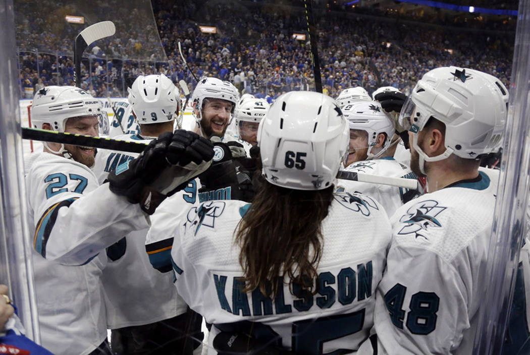 San Jose Sharks defenseman Erik Karlsson (65), of Sweden, is congratulated after scoring the wi ...